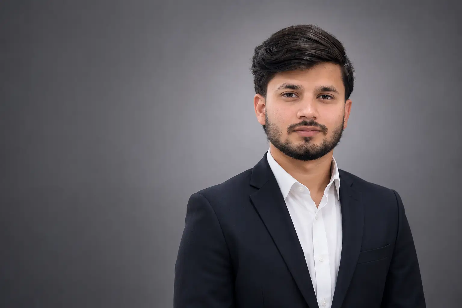 Hummam Azhar, Digital Marketing Consultant at NexWire Digital, professional corporate portrait in business suit.